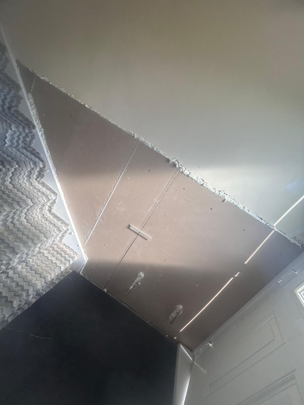 A staircase wall replastered and drying after damp proofing