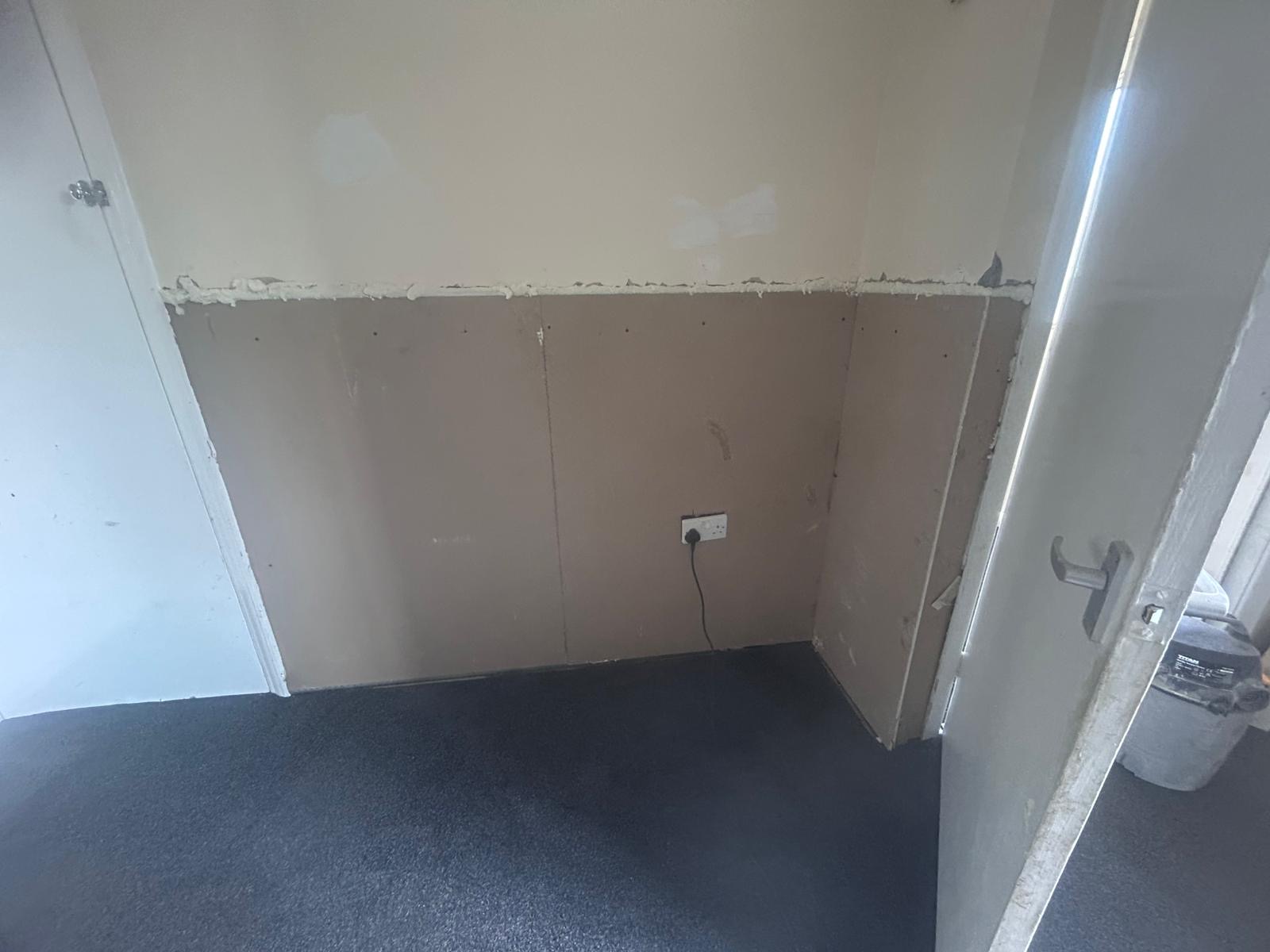 A wall replastered and left ready for decoration